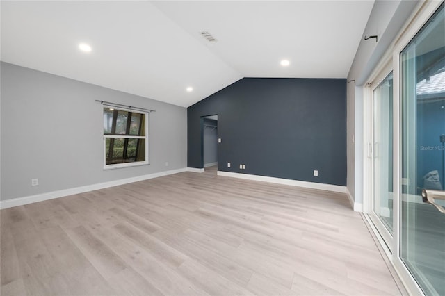 5015 Nassau Cir Unit 4, Orlando, FL 32808 - unfurnished room with light wood finished floors, lofted ceiling, baseboards, and recessed lighting