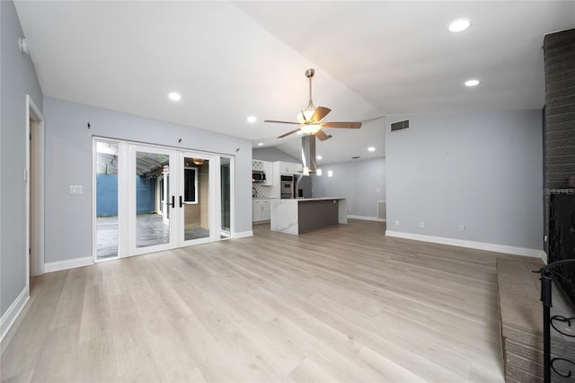 5015 Nassau Cir Unit 4, Orlando, FL 32808 - unfurnished living room with a ceiling fan, lofted ceiling, light wood finished floors, recessed lighting, and baseboards