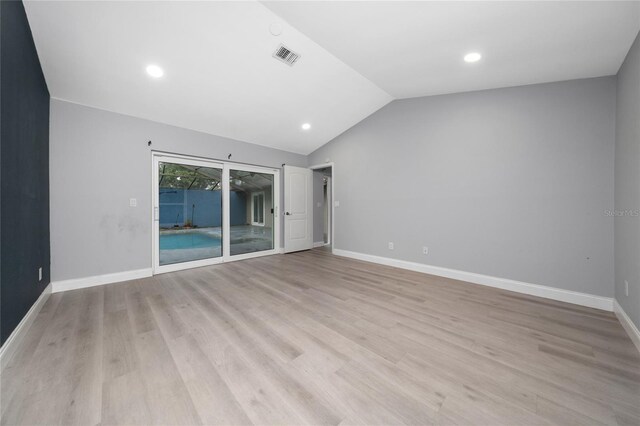 5015 Nassau Cir Unit 4, Orlando, FL 32808 - empty room with light wood-style floors, vaulted ceiling, baseboards, and recessed lighting