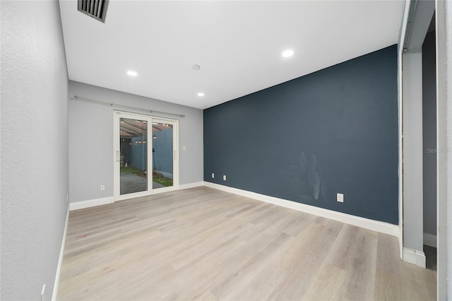 5015 Nassau Cir Unit 4, Orlando, FL 32808 - empty room featuring wood finished floors, recessed lighting, and baseboards