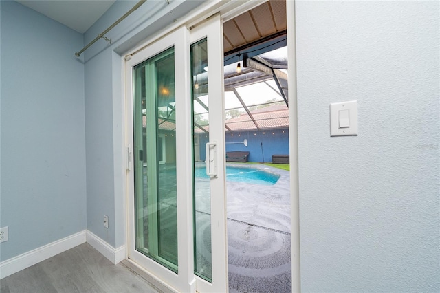 5015 Nassau Cir Unit 4, Orlando, FL 32808 - doorway to outside with baseboards and wood finished floors