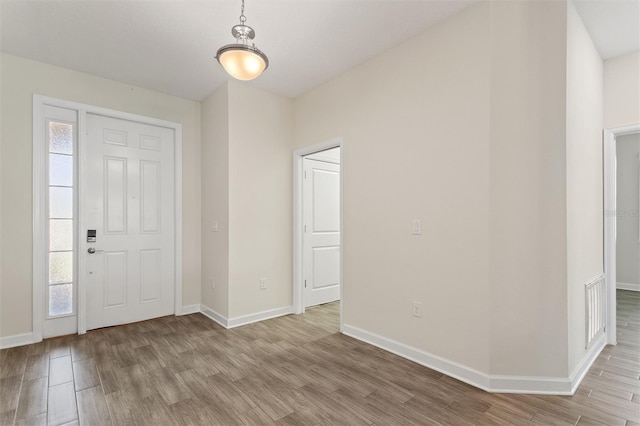 1101 Downswing Pl, Davenport, FL 33896 - entrance foyer with light wood-style floors and baseboards