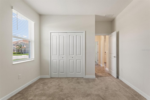 1101 Downswing Pl, Davenport, FL 33896 - unfurnished bedroom featuring carpet floors, baseboards, and a closet