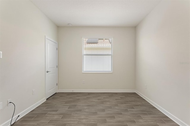1101 Downswing Pl, Davenport, FL 33896 - spare room with wood finished floors and baseboards