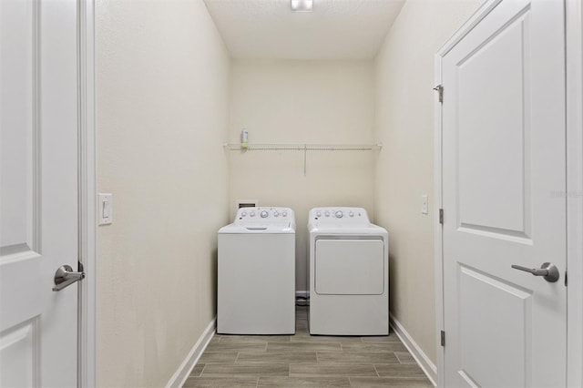 1101 Downswing Pl, Davenport, FL 33896 - laundry area with washing machine and dryer, baseboards, and wood finish floors