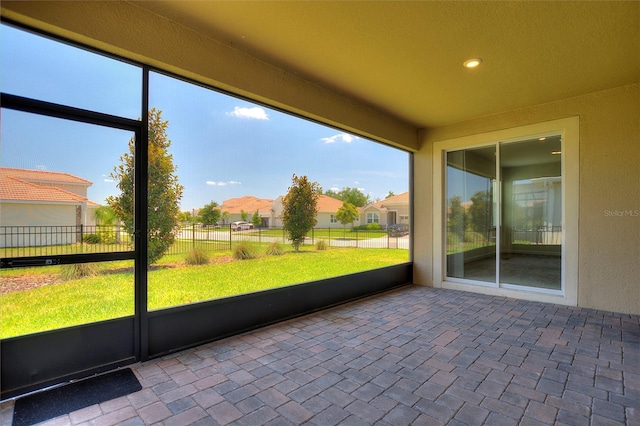 1101 Downswing Pl, Davenport, FL 33896 - unfurnished sunroom featuring a residential view and plenty of natural light