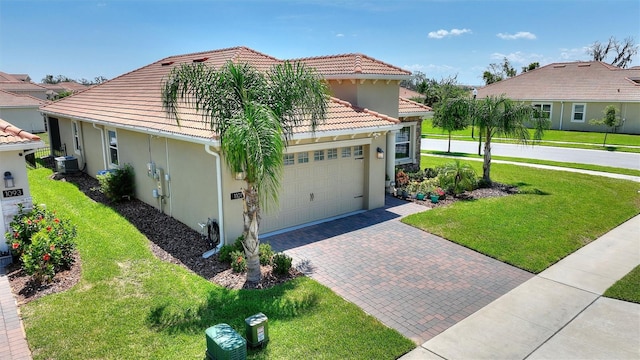 1101 Downswing Pl, Davenport, FL 33896 - view of front facade with stucco siding, a tiled roof, decorative driveway, and a front yard