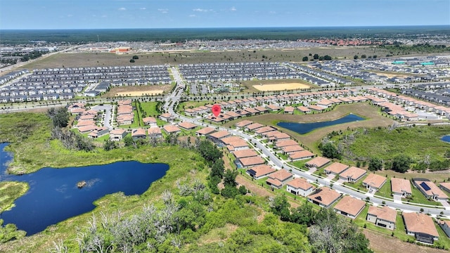 1101 Downswing Pl, Davenport, FL 33896 - aerial view of property's location with a large body of water and nearby suburban area