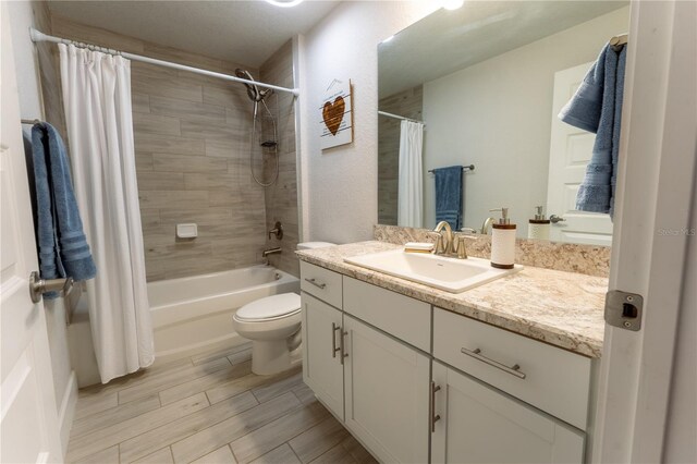6644 SW 179th Court Rd, Dunnellon, FL 34432 - bathroom featuring vanity, shower / bath combination with curtain, toilet, and wood finished floors