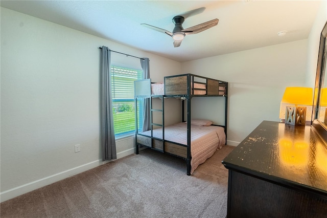 6644 SW 179th Court Rd, Dunnellon, FL 34432 - bedroom with light colored carpet, baseboards, and a ceiling fan