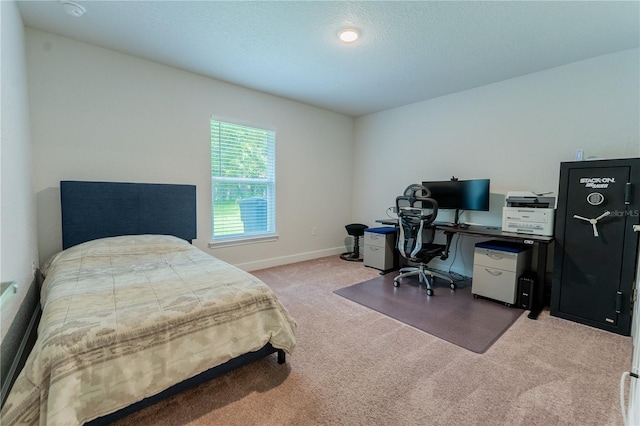 6644 SW 179th Court Rd, Dunnellon, FL 34432 - carpeted bedroom with an office area, baseboards, and a textured ceiling