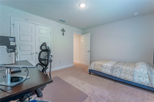 6644 SW 179th Court Rd, Dunnellon, FL 34432 - carpeted bedroom with an office area, baseboards, a closet, and a textured ceiling
