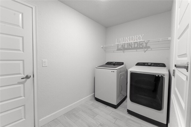 6644 SW 179th Court Rd, Dunnellon, FL 34432 - laundry room featuring washing machine and dryer and baseboards