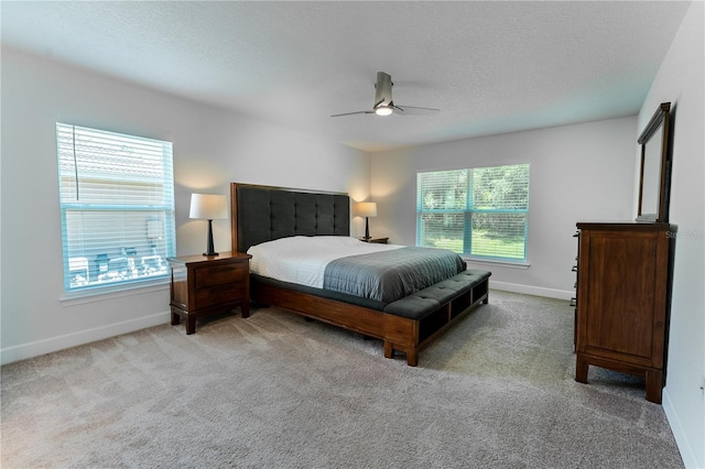 6644 SW 179th Court Rd, Dunnellon, FL 34432 - carpeted bedroom with baseboards, a textured ceiling, and a ceiling fan