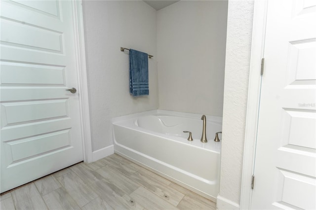 6644 SW 179th Court Rd, Dunnellon, FL 34432 - full bathroom featuring a garden tub and baseboards