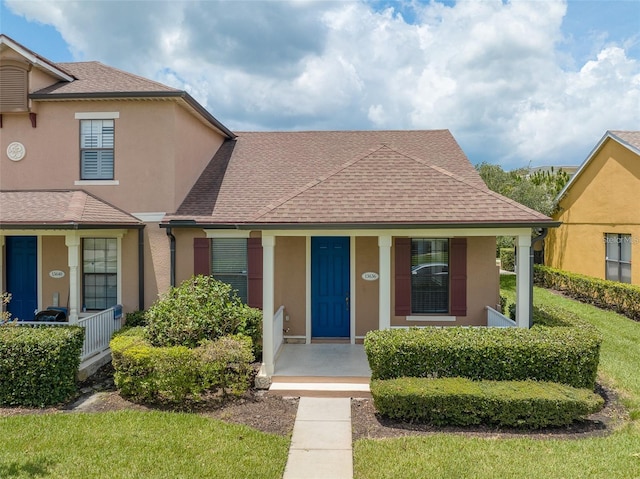13636 Beauregard Pl, Orlando, FL 32837 - view of front of property with a porch, stucco siding, and a shingled roof