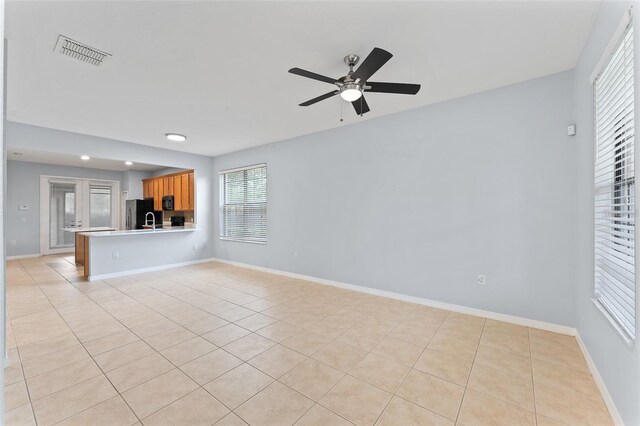 13636 Beauregard Pl, Orlando, FL 32837 - unfurnished living room featuring ceiling fan, light tile patterned floors, baseboards, recessed lighting, and a sink