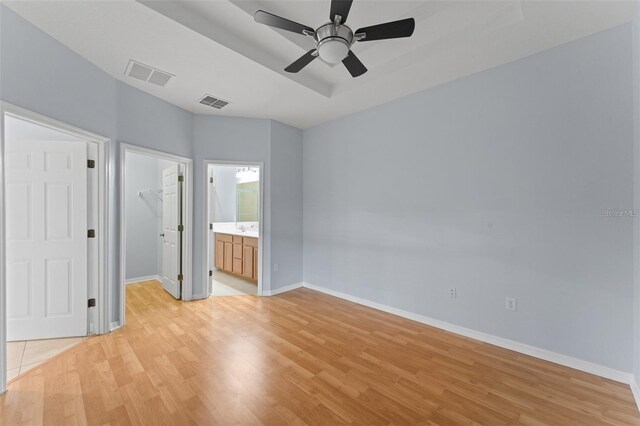 13636 Beauregard Pl, Orlando, FL 32837 - unfurnished bedroom with a walk in closet, light wood-style flooring, and baseboards