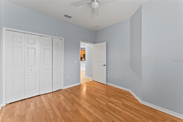 13636 Beauregard Pl, Orlando, FL 32837 - unfurnished bedroom with light wood-type flooring, baseboards, a closet, and ceiling fan