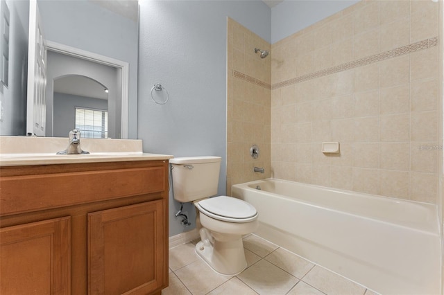 13636 Beauregard Pl, Orlando, FL 32837 - bathroom with toilet, tub / shower combination, vanity, tile patterned floors, and baseboards