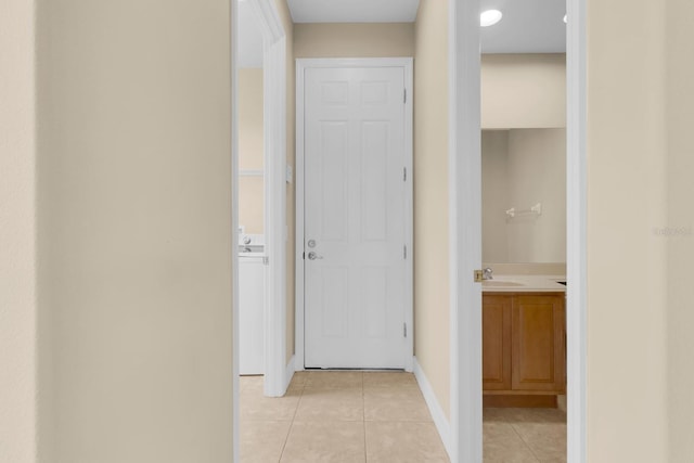 2255 Stone Lake Ct, Orlando, FL 32824 - corridor with light tile patterned flooring and a sink