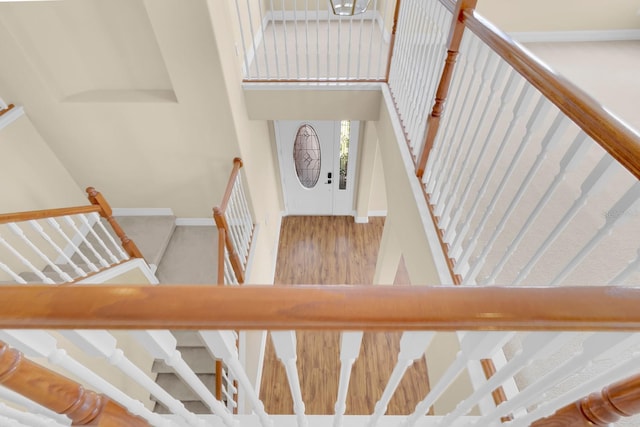 2255 Stone Lake Ct, Orlando, FL 32824 - stairway with baseboards and a towering ceiling