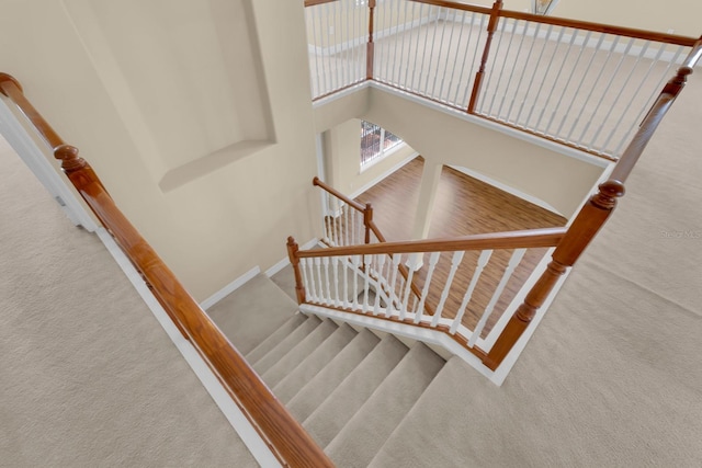 2255 Stone Lake Ct, Orlando, FL 32824 - staircase featuring carpet floors and baseboards