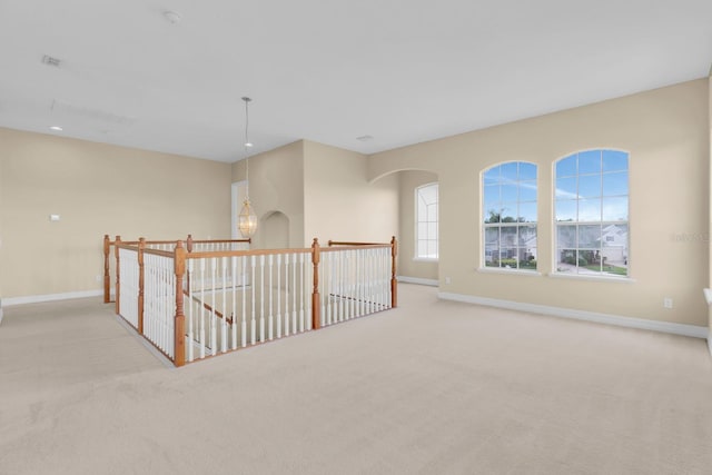2255 Stone Lake Ct, Orlando, FL 32824 - carpeted spare room featuring baseboards and arched walkways