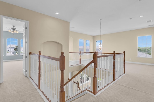 2255 Stone Lake Ct, Orlando, FL 32824 - hallway with carpet flooring, an upstairs landing, plenty of natural light, and recessed lighting