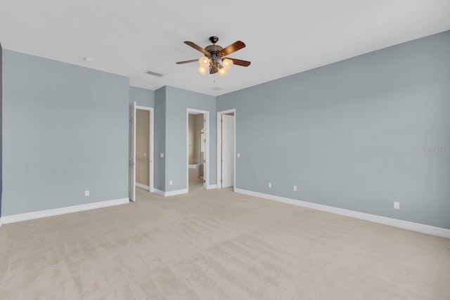 2255 Stone Lake Ct, Orlando, FL 32824 - unfurnished bedroom with light carpet, a ceiling fan, and ensuite bathroom
