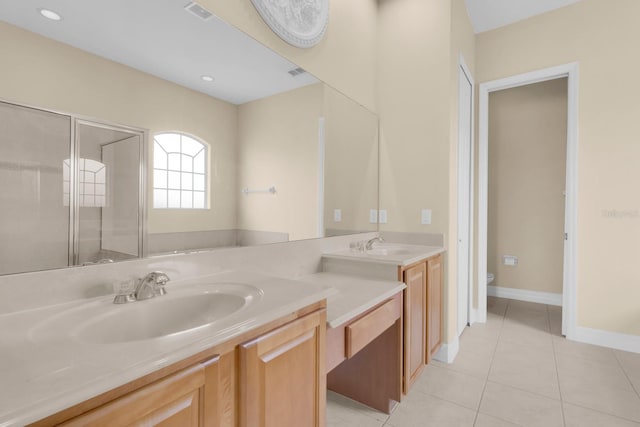 2255 Stone Lake Ct, Orlando, FL 32824 - full bath featuring double vanity, tile patterned flooring, a stall shower, and recessed lighting