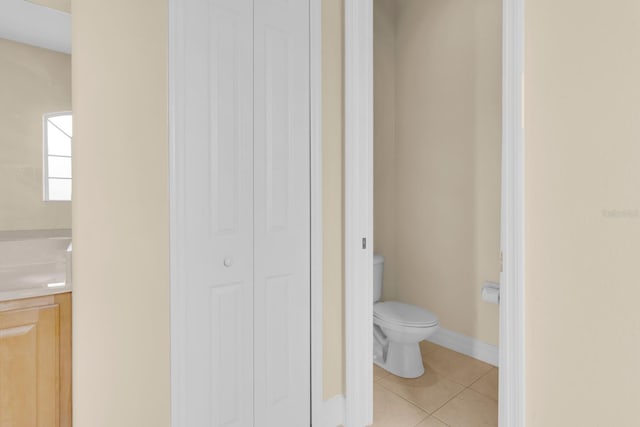 2255 Stone Lake Ct, Orlando, FL 32824 - bathroom featuring a closet, vanity, and tile patterned floors