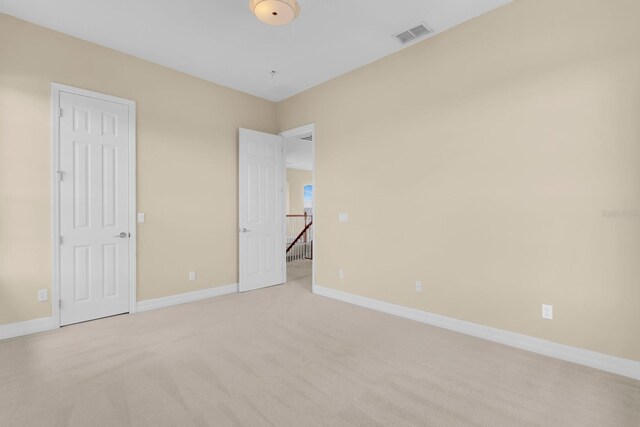 2255 Stone Lake Ct, Orlando, FL 32824 - unfurnished bedroom featuring baseboards and light carpet