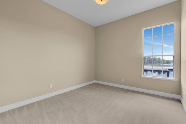 2255 Stone Lake Ct, Orlando, FL 32824 - unfurnished room featuring light carpet and baseboards