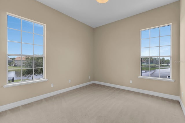2255 Stone Lake Ct, Orlando, FL 32824 - spare room featuring baseboards and carpet floors