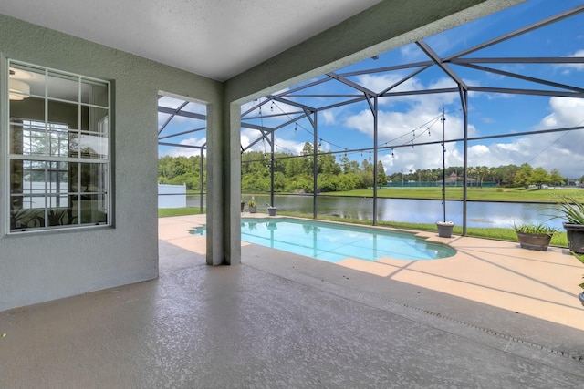 2255 Stone Lake Ct, Orlando, FL 32824 - swimming pool featuring a patio, a water view, and glass enclosure