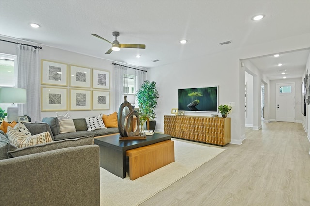 224 Thornberry Way, Palm Coast, FL 32164 - living area featuring light wood finished floors, ceiling fan, healthy amount of natural light, recessed lighting, and baseboards