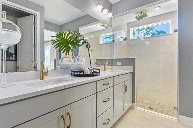 217 Thornberry Way, Palm Coast, FL 32164 - full bathroom featuring a tile shower, tile patterned floors, and double vanity