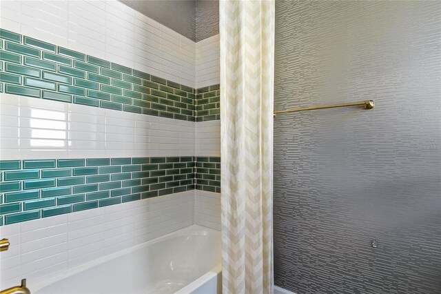 217 Thornberry Way, Palm Coast, FL 32164 - bathroom with shower / bath combo with shower curtain
