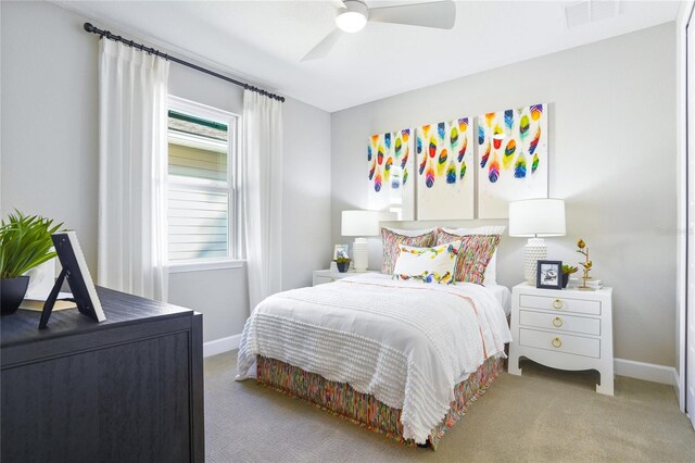 217 Thornberry Way, Palm Coast, FL 32164 - bedroom with carpet, baseboards, and a ceiling fan