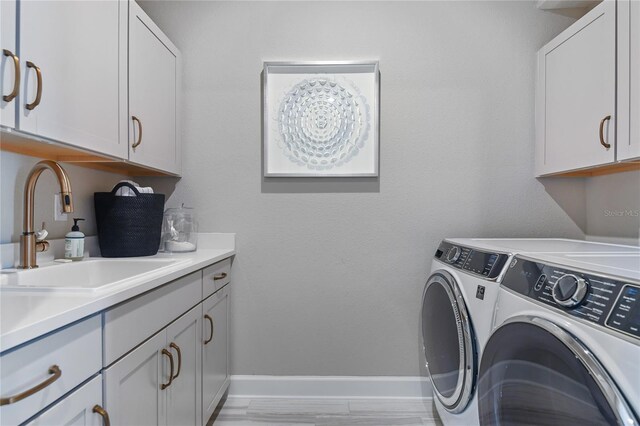 217 Thornberry Way, Palm Coast, FL 32164 - washroom with independent washer and dryer, cabinet space, and baseboards