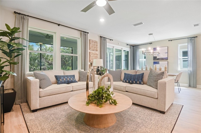212 Thornberry Way, Palm Coast, FL 32164 - living area featuring light wood finished floors, ceiling fan, and plenty of natural light