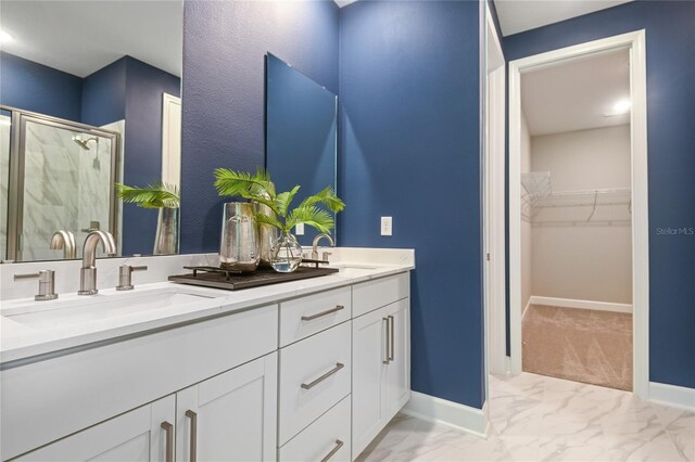 212 Thornberry Way, Palm Coast, FL 32164 - bathroom featuring double vanity, a shower stall, marble finish flooring, and a spacious closet