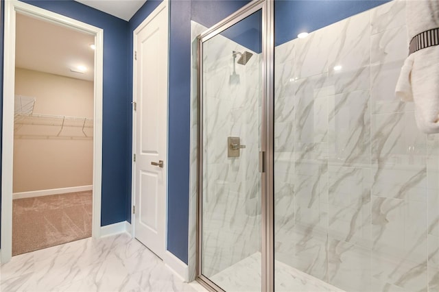 212 Thornberry Way, Palm Coast, FL 32164 - bathroom with a marble finish shower, a walk in closet, and marble finish flooring