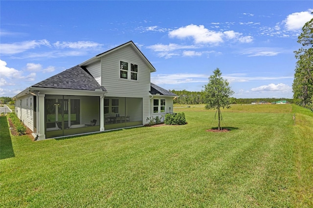 212 Thornberry Way, Palm Coast, FL 32164 - rear view of house featuring roof with shingles, a lawn, and a sunroom