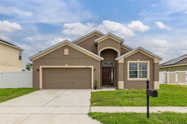 326 Highland Meadows Ave, Davenport, FL 33837 - view of front of home featuring a garage, stucco siding, and concrete driveway