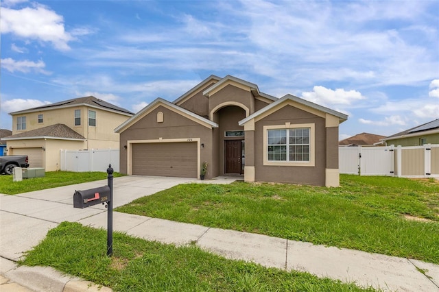 326 Highland Meadows Ave, Davenport, FL 33837 - view of front of home featuring a gate, concrete driveway, an attached garage, and stucco siding