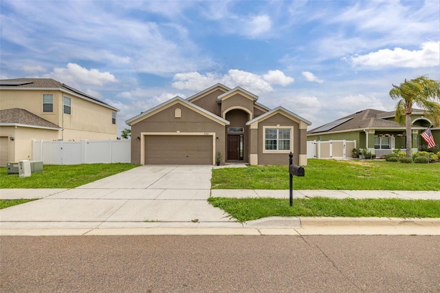 326 Highland Meadows Ave, Davenport, FL 33837 - view of front of property with a garage, concrete driveway, and stucco siding