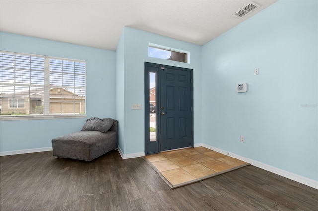 326 Highland Meadows Ave, Davenport, FL 33837 - entrance foyer featuring wood finished floors, baseboards, and healthy amount of natural light