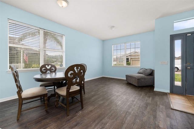 326 Highland Meadows Ave, Davenport, FL 33837 - dining room featuring dark wood finished floors and baseboards